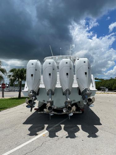Slide: The Image of 2025 Contender 44ST boat with four powerful outboard engines, rear view. - 15