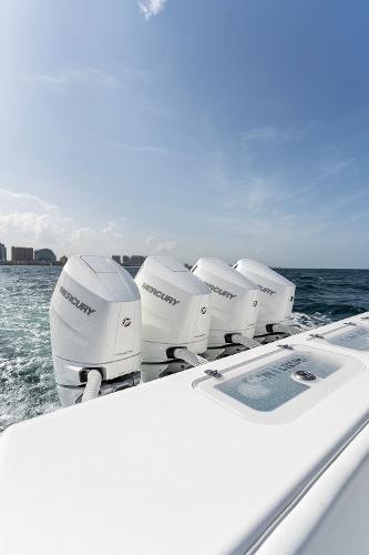 Slide: The Image of Contender 2025 44ST boat with triple Mercury outboard engines on the ocean. - 30