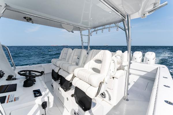 Slide: The Image of Contender 2025 44ST boat interior with white seating and ocean view. - 34