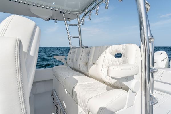 Slide: The Image of Contender 2025 44ST boat with luxurious white seating on open water. - 35
