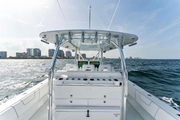 Slide: The Image of Contender 2025 44ST boat on open water with city skyline in background. - 38