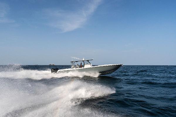 Slide: The Image of Contender 2025 44ST boat speeding on open water. - 40