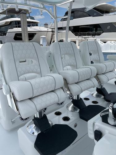 Slide: The Image of Luxurious seating on the 2025 Contender 44ST boat, featuring plush white upholstery. - 9
