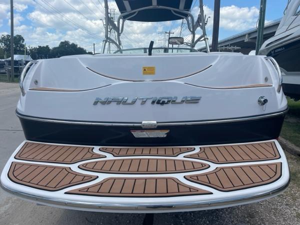 Slide: The Image of 2008 Correct Craft 220 TE Nautique boat rear view with teak swim platform. - 2