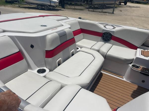 Slide: The Image of Interior of 2008 Correct Craft 220 TE boat with white and red seating. - 4