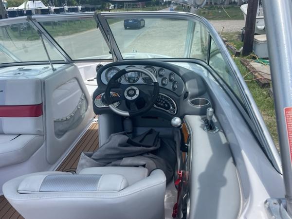 Slide: The Image of 2008 Correct Craft 220 TE boat interior with steering wheel and dashboard. - 6