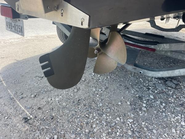 Slide: The Image of Propeller and rudder of a 2008 Correct Craft 220 TE boat on a trailer. - 7