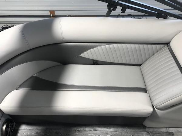 Slide: The Image of 2018 Crest II 230 SLC boat interior with sleek, modern seating design. - 7