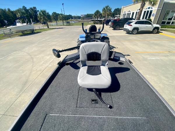 Slide: The Image of 2023 Crestliner 1600 Storm fishing boat with a swivel seat and trolling motor. - 11