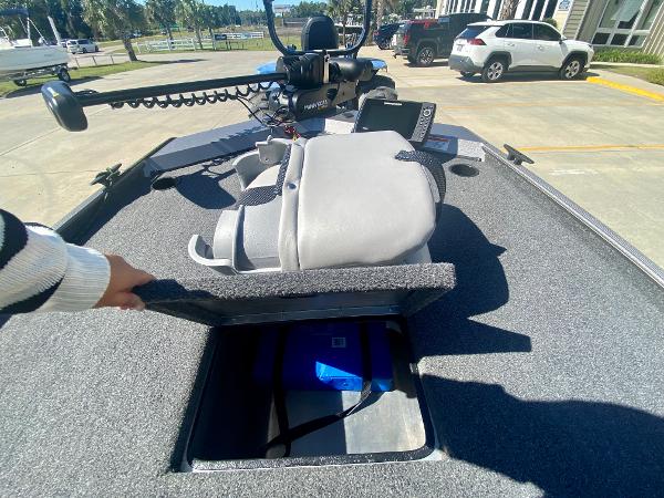 Slide: The Image of 2023 Crestliner 1600 Storm boat interior with open storage compartment. - 12