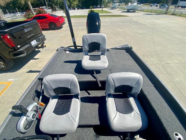 Slide: The Image of 2023 Crestliner 1600 Storm boat interior with three gray seats. - 7