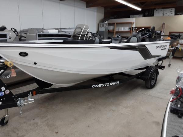 Slide: The Image of 2024 Crestliner 1650 Hawk fishing boat on trailer in showroom. - 0