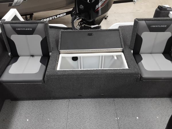 Slide: The Image of 2024 Crestliner 1650 Hawk boat interior with seating and storage compartment. - 10