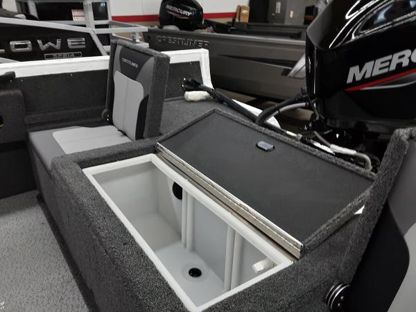 Slide: The Image of 2024 Crestliner 1650 Hawk boat interior with storage compartment and Mercury engine. - 4