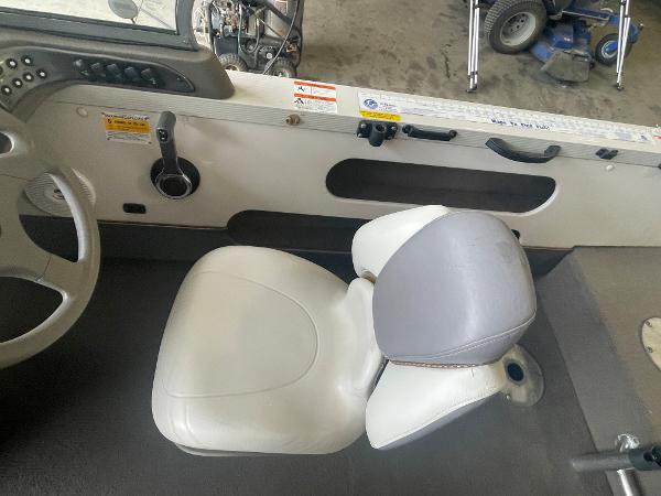 Slide: The Image of Interior of a 2004 Crestliner 1700 SUPER HAWK boat with steering wheel and seat. - 10