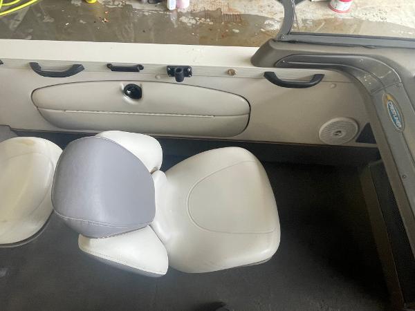 Slide: The Image of 2004 Crestliner 1700 SUPER HAWK interior with white and gray seating. - 11