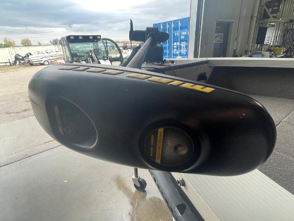 Slide: The Image of Close-up of a 2004 Crestliner 1700 SUPER HAWK boat motor in a garage. - 12