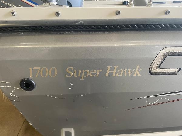 Slide: The Image of 2004 Crestliner 1700 Super Hawk boat side view with model name. - 13