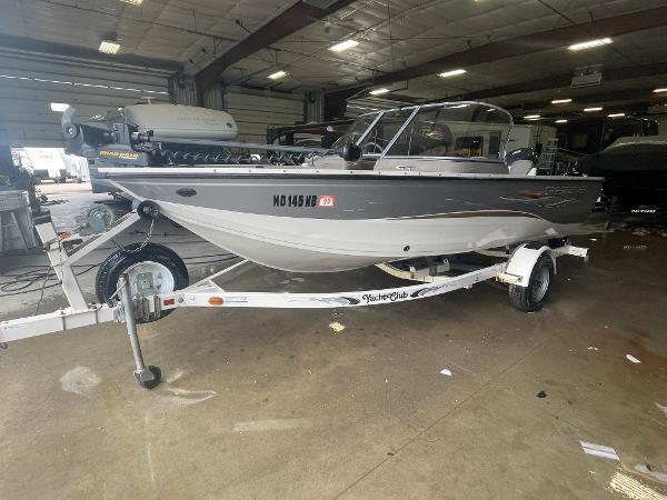 Slide: The Image of 2004 Crestliner 1700 SUPER HAWK boat on trailer in indoor storage facility. - 2