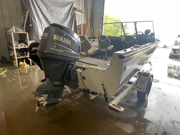 Slide: The Image of 2004 Crestliner 1700 SUPER HAWK boat with Yamaha 115 outboard motor in a garage. - 4