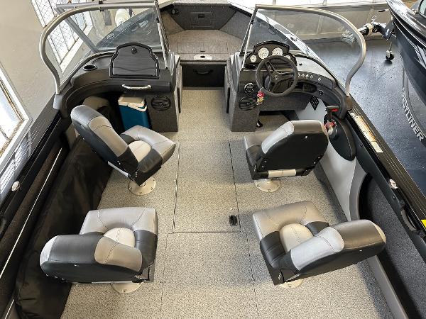 Slide: The Image of 2025 Crestliner 1950 Super Hawk boat interior with four seats and steering console. - 5