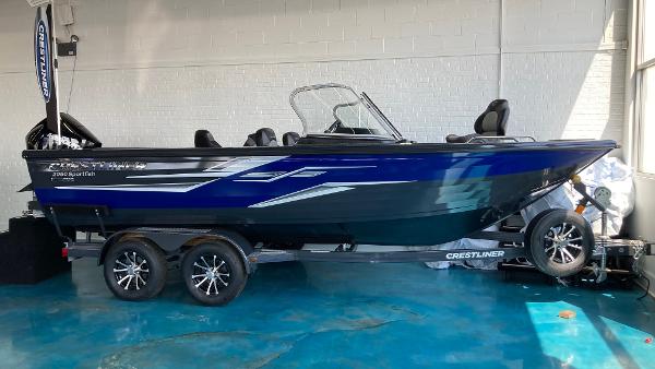 Slide: The Image of 2024 Crestliner 2050 Sportfish boat on trailer in showroom. - 0