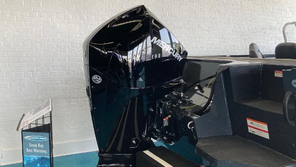Slide: The Image of 2024 Crestliner 2050 Sportfish with Mercury outboard motor in showroom. - 1