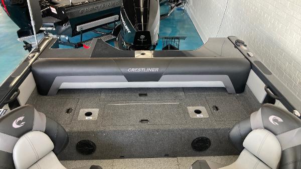 Slide: The Image of 2024 Crestliner 2050 Sportfish boat interior with seating and storage compartments. - 3