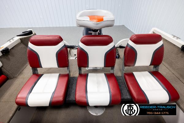 Slide: The Image of 2005 Crestliner 1750 FISHHAWK boat seats, red and white upholstery, Reeder-Trausch Marine logo. - 17