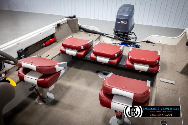 Slide: The Image of 2005 Crestliner 1750 FISHHAWK boat interior with red and white seating and outboard motor. - 18