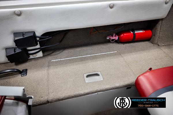 Slide: The Image of 2005 Crestliner 1750 FISHHAWK interior with fire extinguisher and storage compartment. - 22
