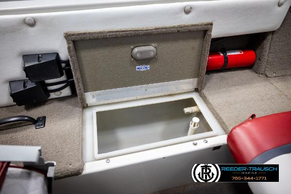 Slide: The Image of 2005 Crestliner 1750 FISHHAWK boat interior with storage compartment and fire extinguisher. - 23