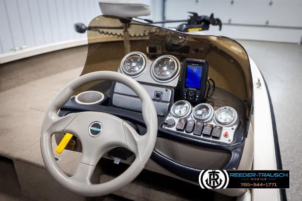 Slide: The Image of 2005 Crestliner 1750 FISHHAWK boat dashboard with steering wheel and gauges. - 26