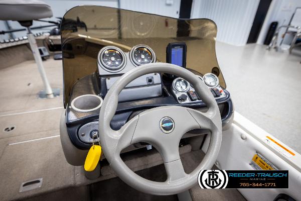 Slide: The Image of 2005 Crestliner 1750 FISHHAWK boat dashboard with steering wheel and gauges. - 27