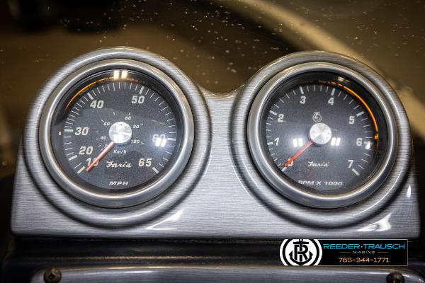 Slide: The Image of Dashboard gauges of a 2005 Crestliner 1750 FISHHAWK boat, showing speed and RPM. - 29