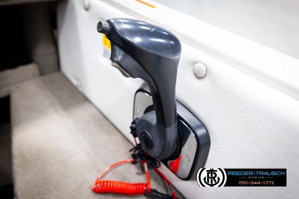 Slide: The Image of Boat throttle control in a 2005 Crestliner 1750 Fishhawk, featuring a safety lanyard. - 34
