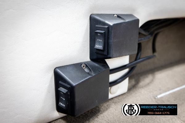 Slide: The Image of Switches on a 2005 Crestliner 1750 FISHHAWK boat interior, featuring wiring and controls. - 35