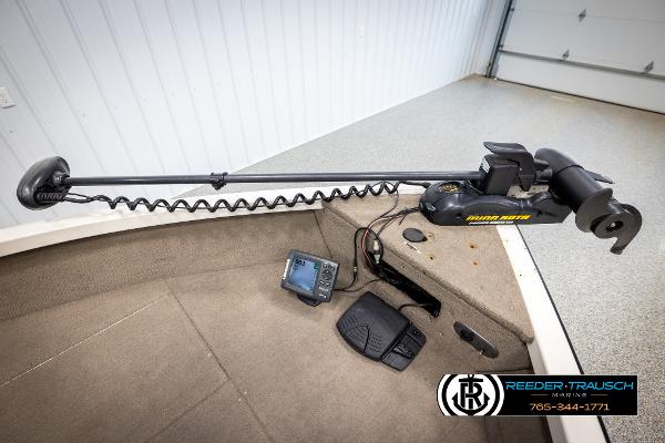 Slide: The Image of 2005 Crestliner 1750 FISHHAWK boat with trolling motor and fish finder in a garage. - 37