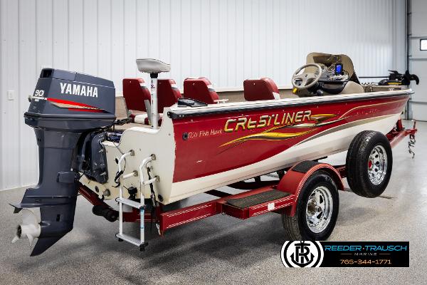 Slide: The Image of 2005 Crestliner 1750 FISHHAWK boat with Yamaha motor, red and white design, in showroom. - 4