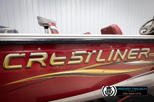 Slide: The Image of 2005 Crestliner 1750 FISHHAWK boat, red exterior with gold lettering, side view. - 46
