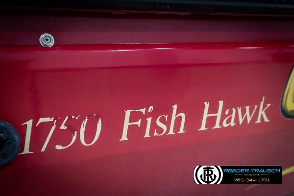 Slide: The Image of Red Crestliner 1750 Fish Hawk boat, 2005 model, with visible branding and contact details. - 47