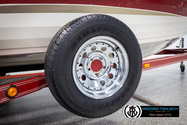 Slide: The Image of Trailer tire of 2005 Crestliner 1750 FISHHAWK boat on red trailer. - 48