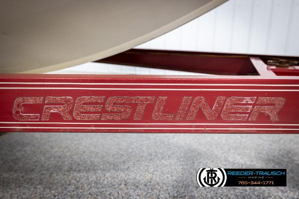 Slide: The Image of Red Crestliner boat trailer for 2005 1750 FISHHAWK model, featuring brand logo. - 49