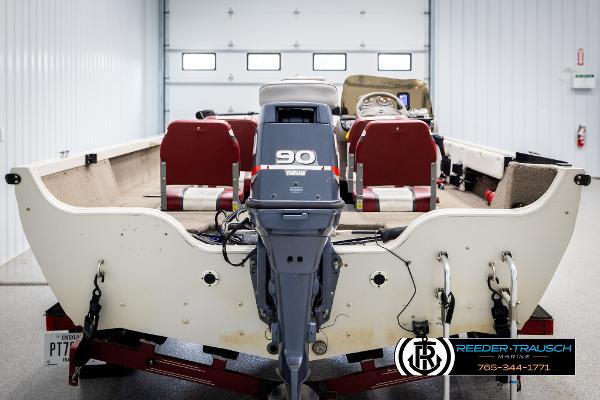 Slide: The Image of 2005 Crestliner 1750 FISHHAWK boat with Yamaha 90 engine in a garage setting. - 5