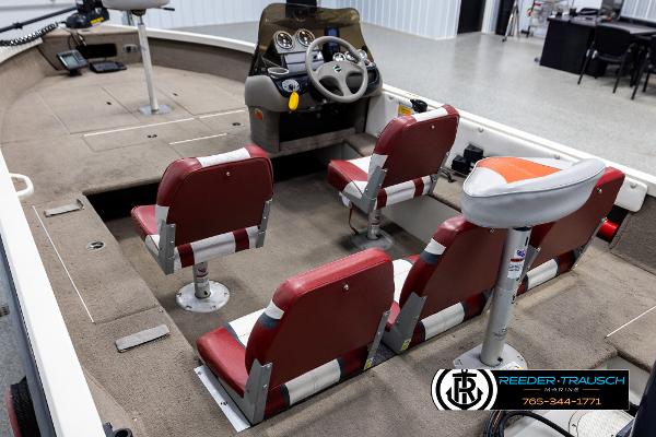 Slide: The Image of 2005 Crestliner 1750 FISHHAWK boat interior with red seats and steering console. - 9