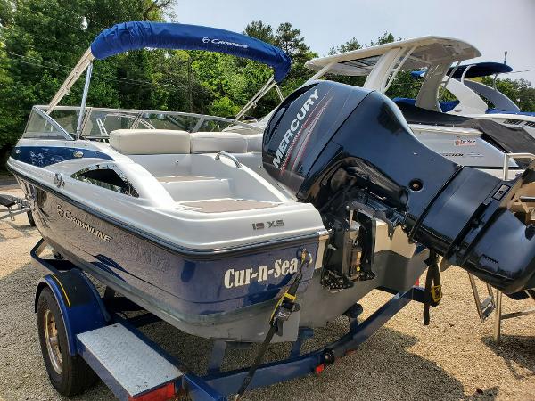 Slide: The Image of 2013 Crownline 19XS boat with Mercury outboard motor on trailer. - 0