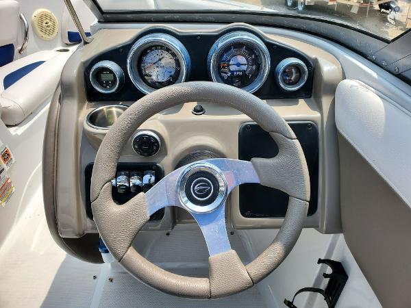 Slide: The Image of Steering wheel and dashboard of a 2013 Crownline 19XS boat. - 4