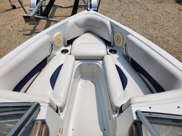 Slide: The Image of 2013 Crownline 19XS boat interior with white and blue seating. - 6