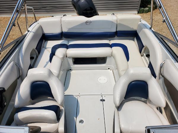 Slide: The Image of 2013 Crownline 19XS boat interior with white and blue seating. - 7