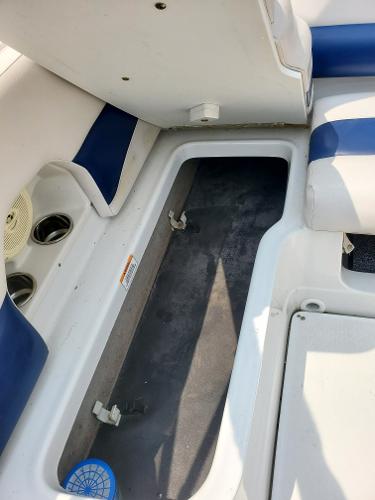 Slide: The Image of 2013 Crownline 19XS boat interior storage compartment. - 9
